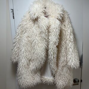 PrettyLittleThing  Naomi Campbell Cream Faux Fur Jacket